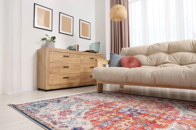 Faded rug in a living room, couch on top of rug