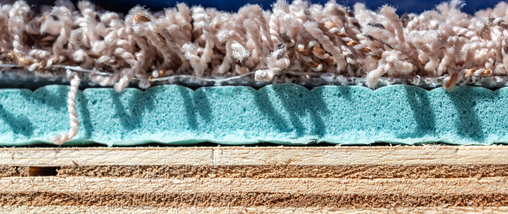 Cross section of carpet, carpet pad, and plywood floor